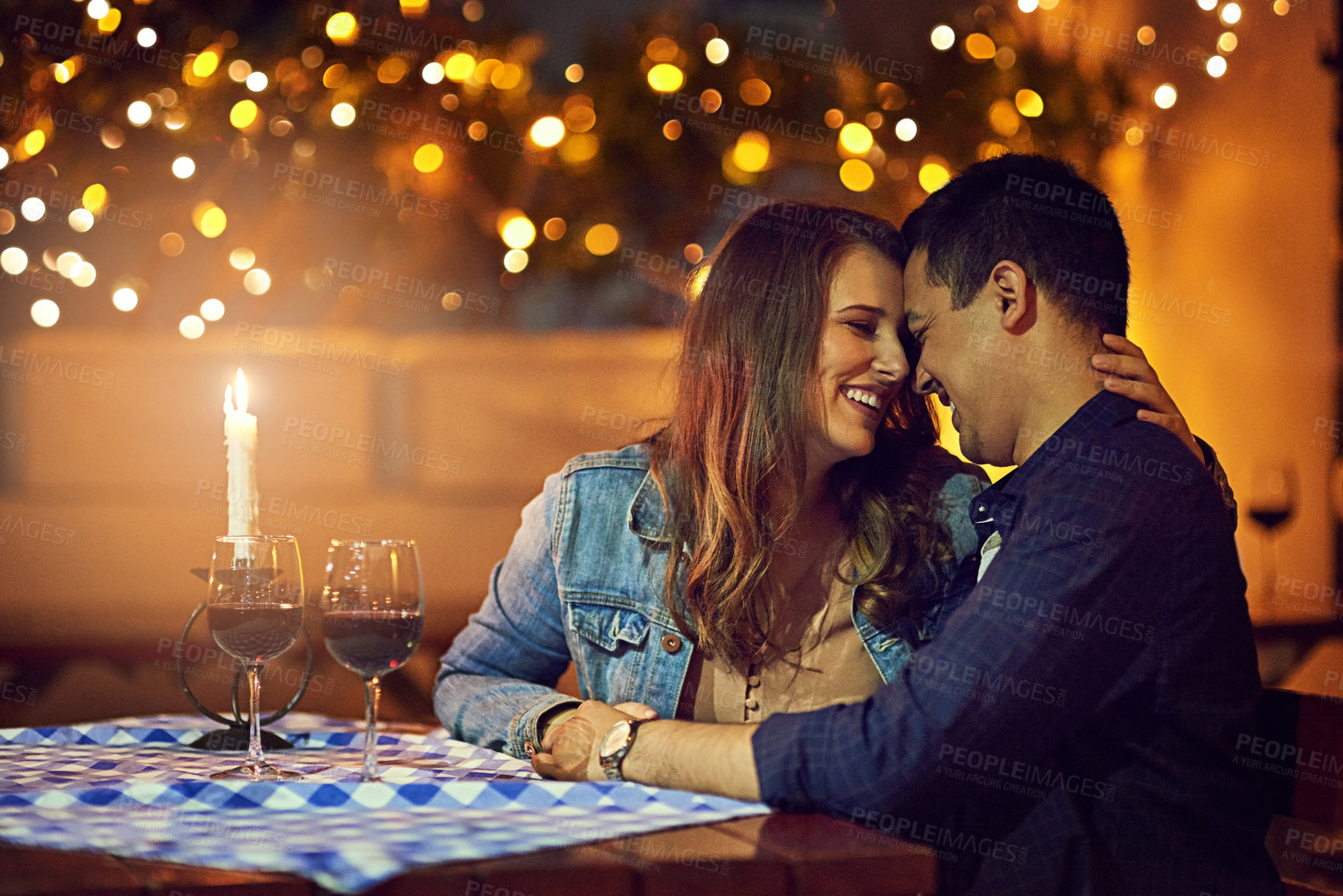 Buy stock photo Shot of an affectionate couple out on a romantic date