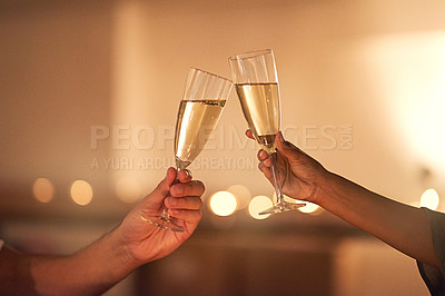 Buy stock photo Closeup shot of an unrecognizable couple toasting with glasses of wine