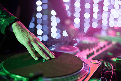 Buy stock photo Closeup shot of a DJ mixing music on a turntable