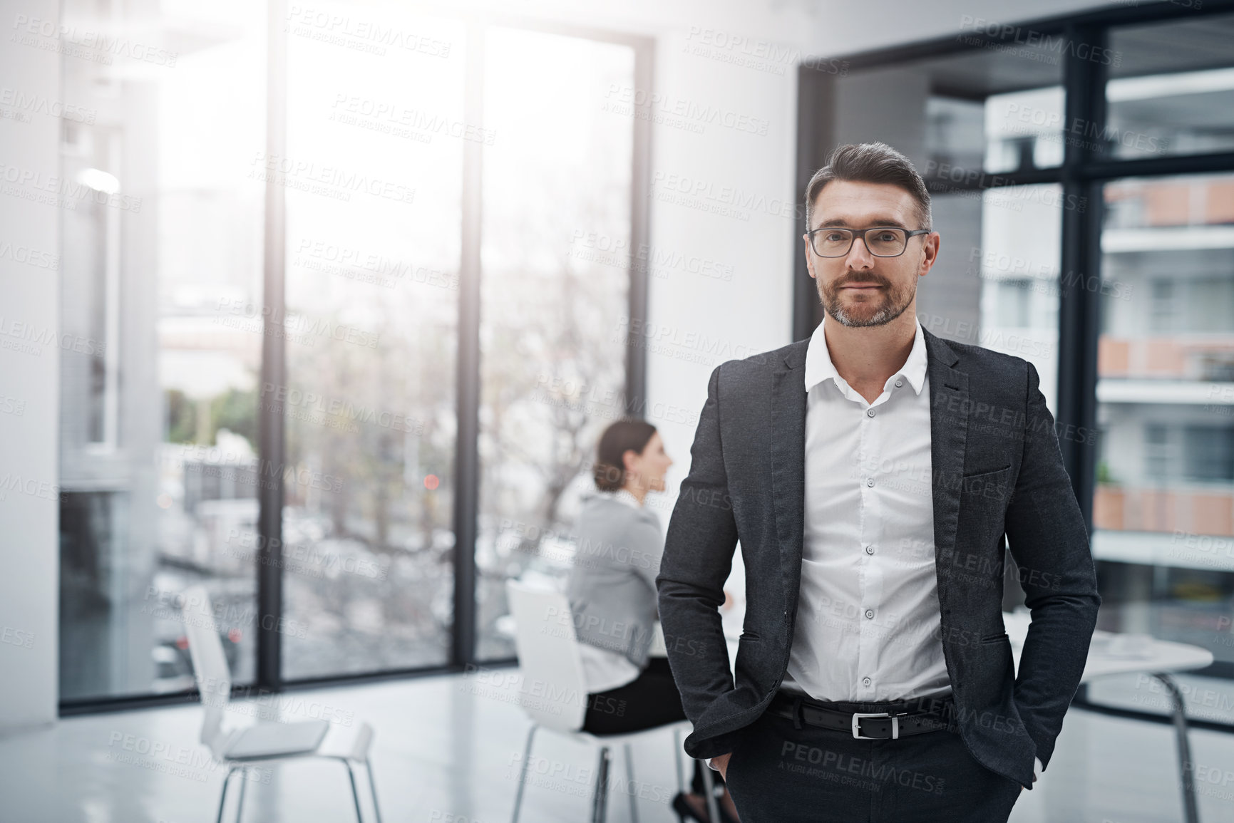 Buy stock photo Portrait of a handsome businessman standing in the boardroom during a meeting