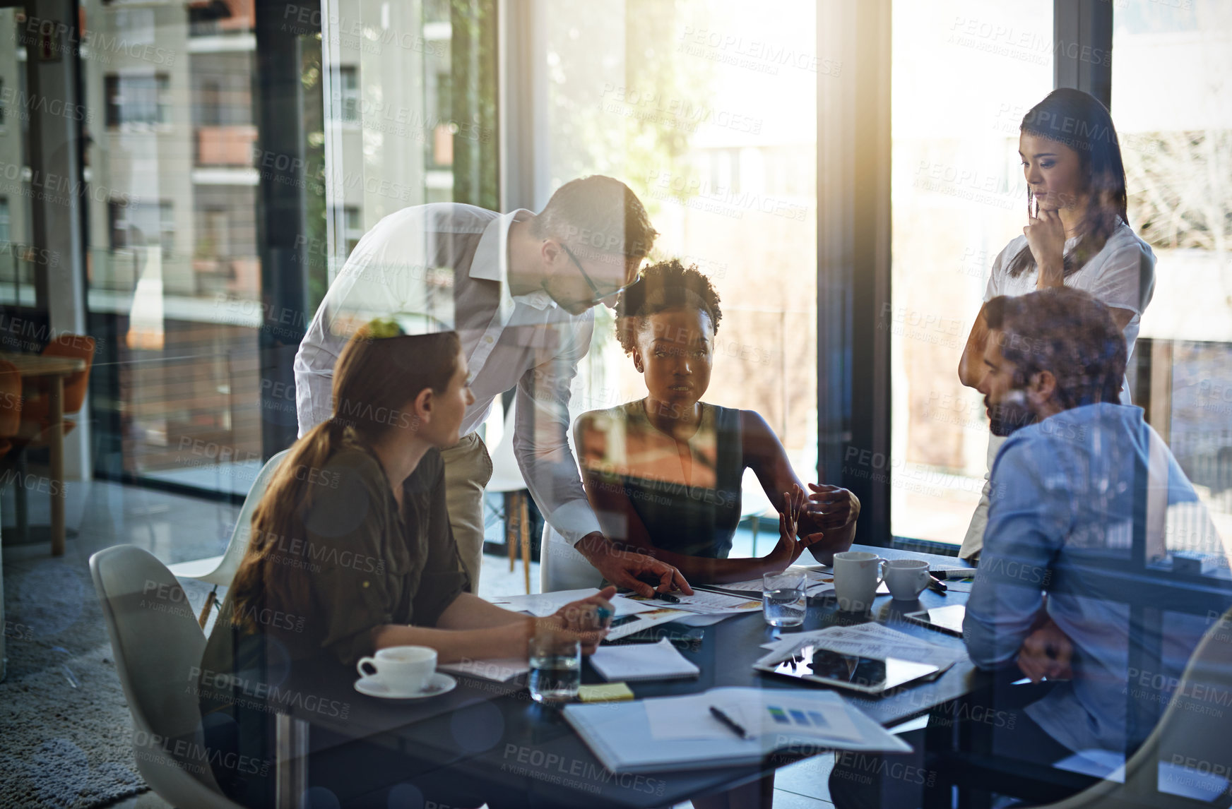 Buy stock photo Shot of a group of businesspeople having a meeting in a boardroom