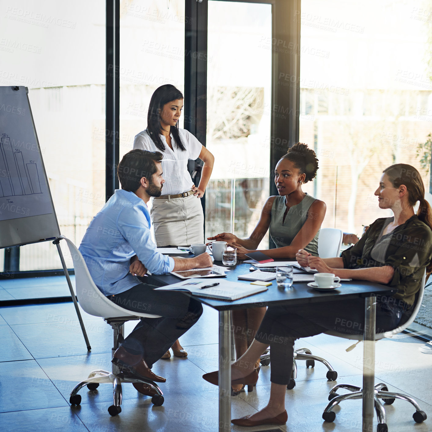 Buy stock photo Shot of a group of businesspeople having a meeting in a boardroom