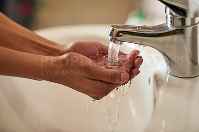 Buy stock photo Closeup shot of an unrecognizable woman washing her hands in a bathroom