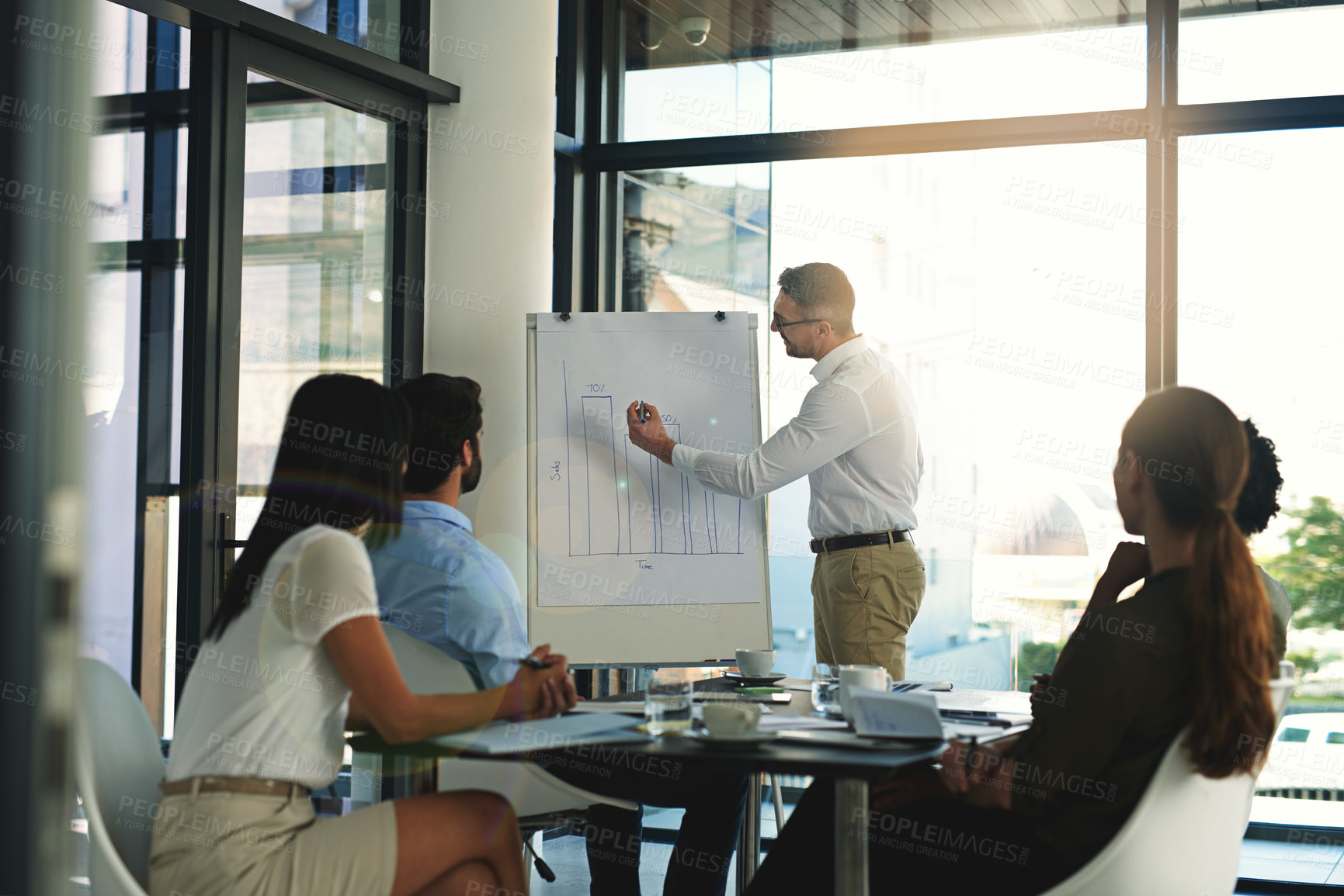 Buy stock photo Shot of a businessman giving a presentation in the boardroom