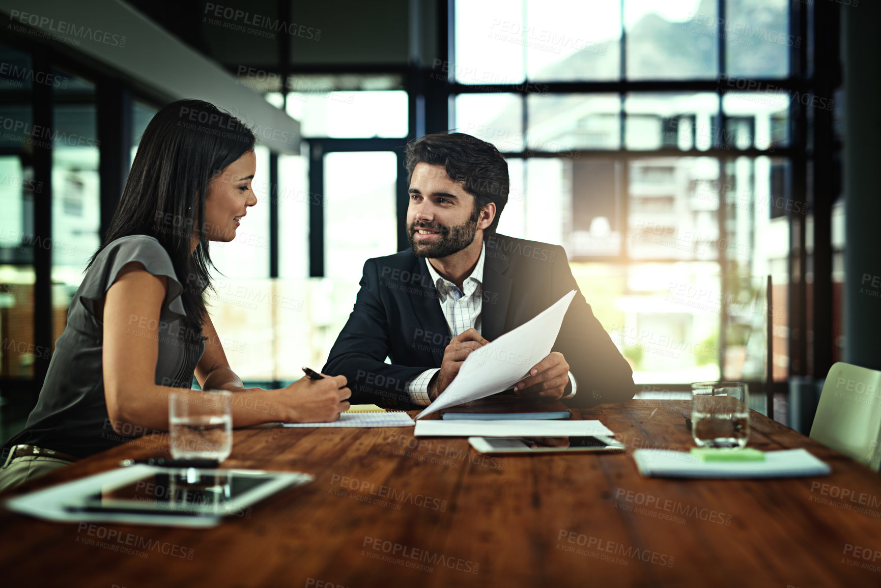 Buy stock photo Meeting, discussion and business people with paperwork in office for feedback, budget review or profit report. Financial consultant, talking and employees for conversation, collaboration or teamwork