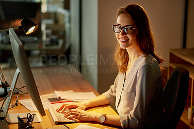 Buy stock photo Portrait of an attractive young businesswoman working late in the office