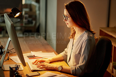 Buy stock photo Woman, employee and typing on computer in office at work for overtime or deadline at night. Female person, worker and pc for online research on internet with notepad for notes as administrator