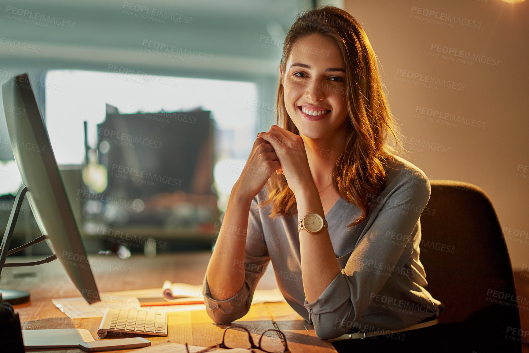 Buy stock photo Portrait of an attractive young businesswoman working late in the office