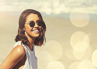 Buy stock photo Shot of an attractive young woman enjoying a day on the beach