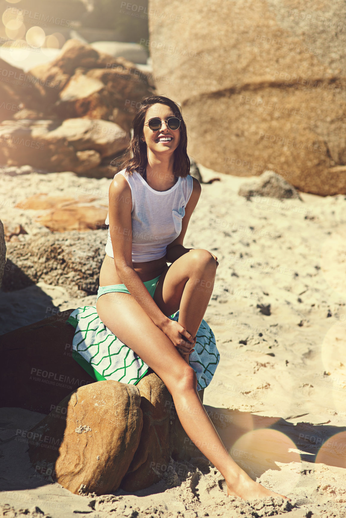 Buy stock photo Shot of an attractive young woman enjoying a day on the beach