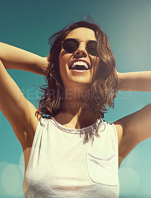 Buy stock photo Shot of an attractive young woman enjoying a day on the beach