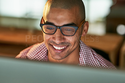 Buy stock photo Cropped shot of a young designer working late in an office