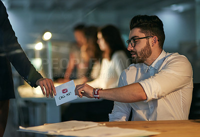 Buy stock photo Cropped shot of a love note being passed from one colleague to another
