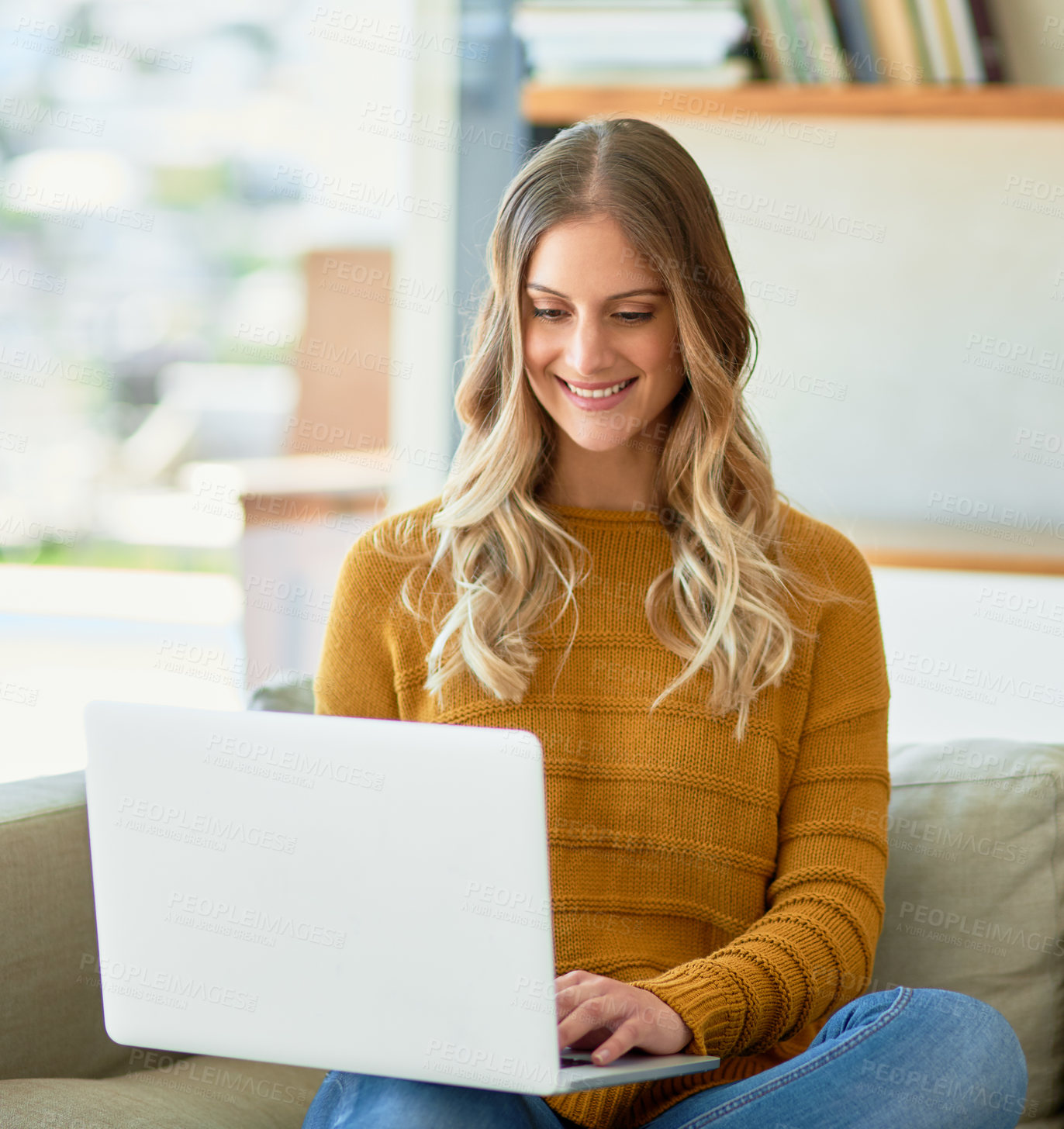 Buy stock photo Woman, creative and laptop with smile, typing and lounge for deadline as freelancer or copywriter. Female person, journalist and technology for article, story or newsletter in work from home for job