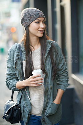 Buy stock photo Woman, fashion and denim with coffee, travel and city street or background for style. Asian student, beanie and jacket in cape town with winter, cold and adventure with urban holiday for confidence