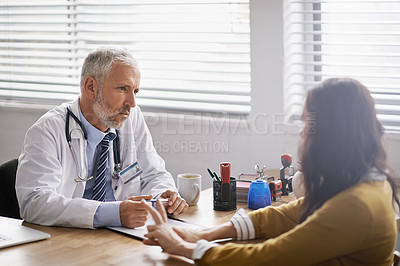 Buy stock photo Healthcare, doctor and woman in consultation, conversation and discussion for diagnosis in an office. Female patient, medical professional and male employee in the hospital, treatment and talking