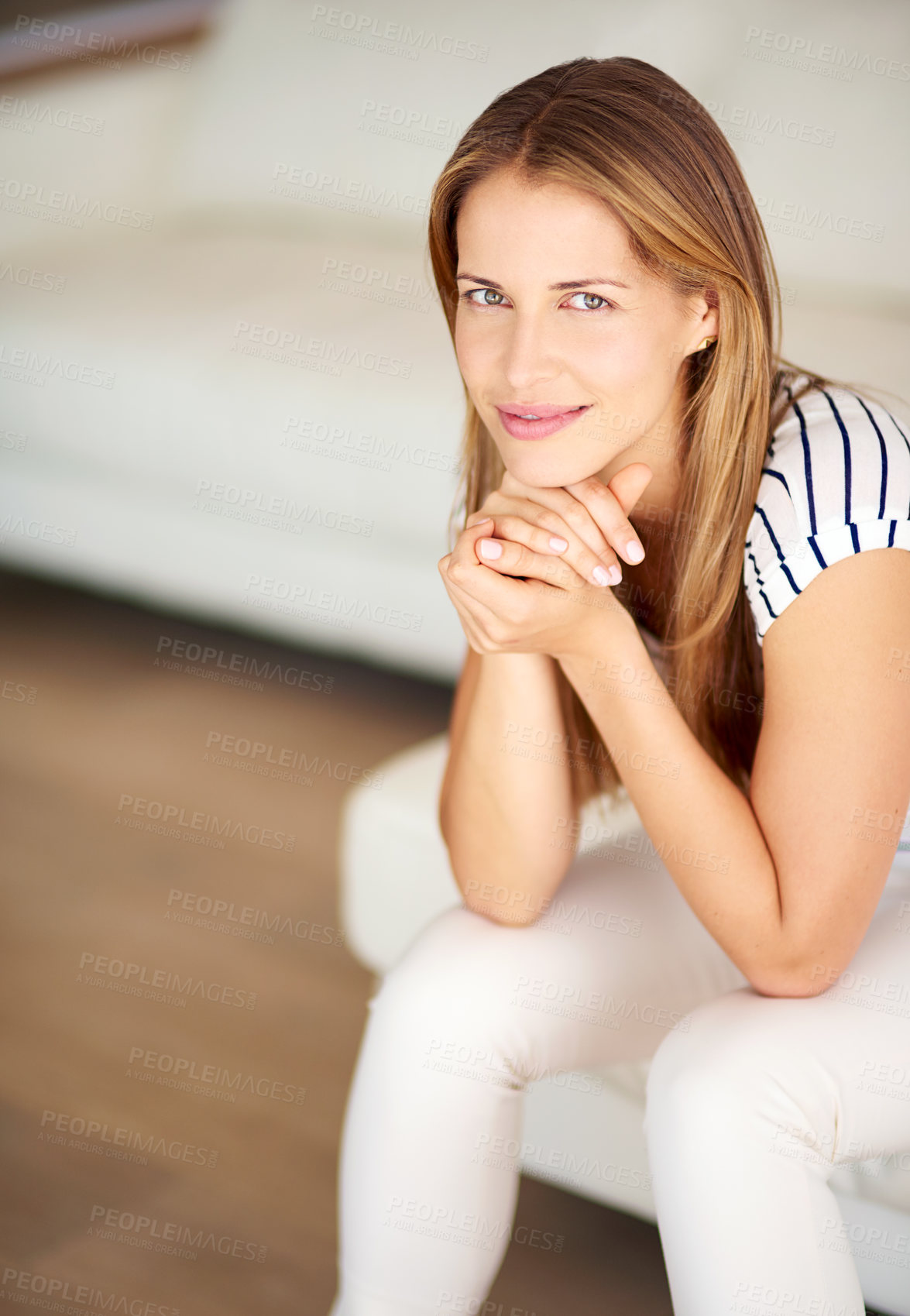 Buy stock photo Shot of a young woman relaxing on the sofa at home