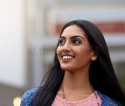 Buy stock photo Shot of an attractive young woman walking outside