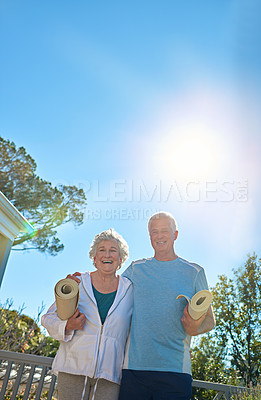 Buy stock photo Portrait of a senior couple standing outside ready to do yoga together