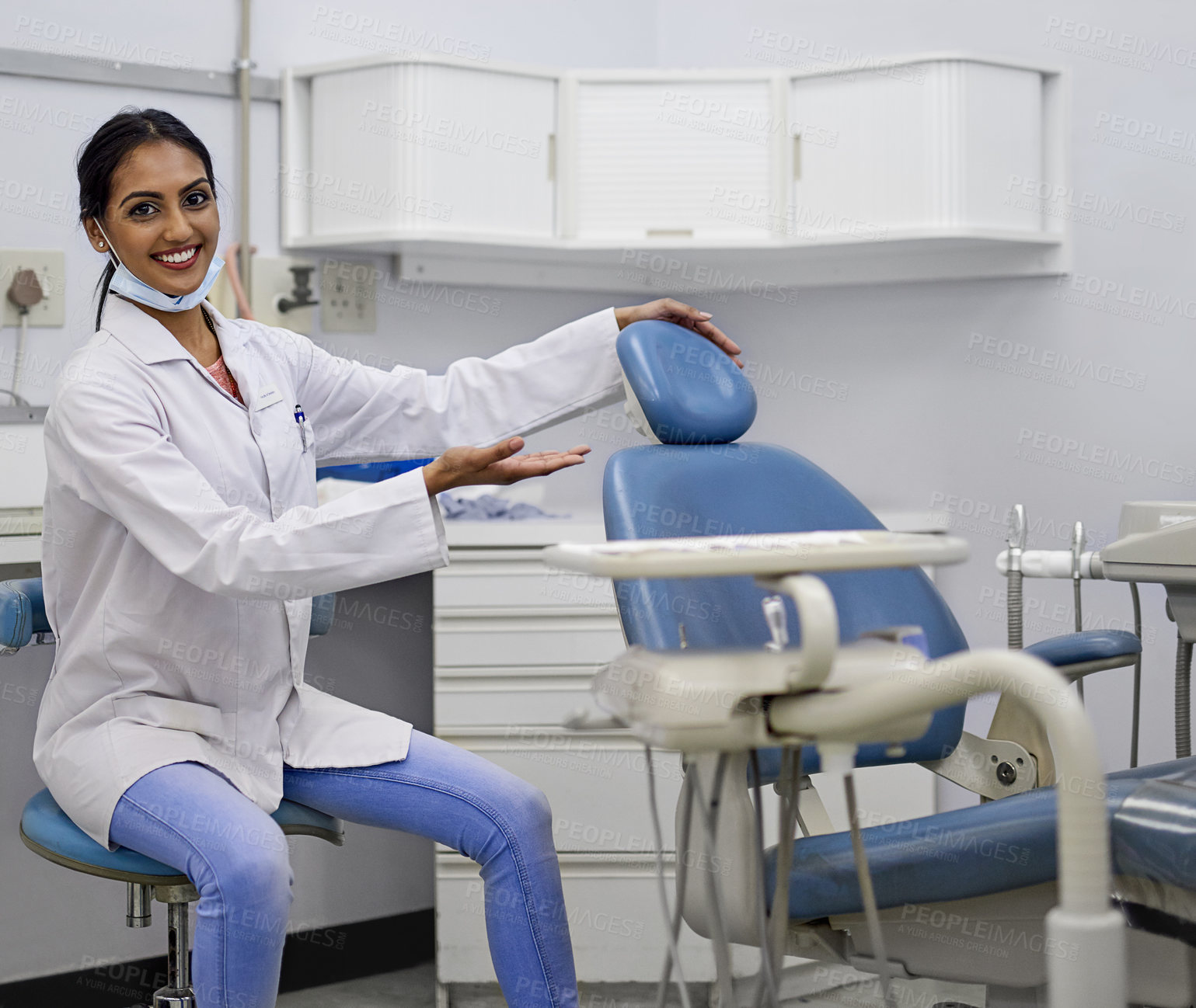 Buy stock photo Dentist, happy and portrait in office with chair, woman and oral healthcare with professional or hand gesture for patient. Dental clinic, orthodontist and teeth appointment, whitening and checkup