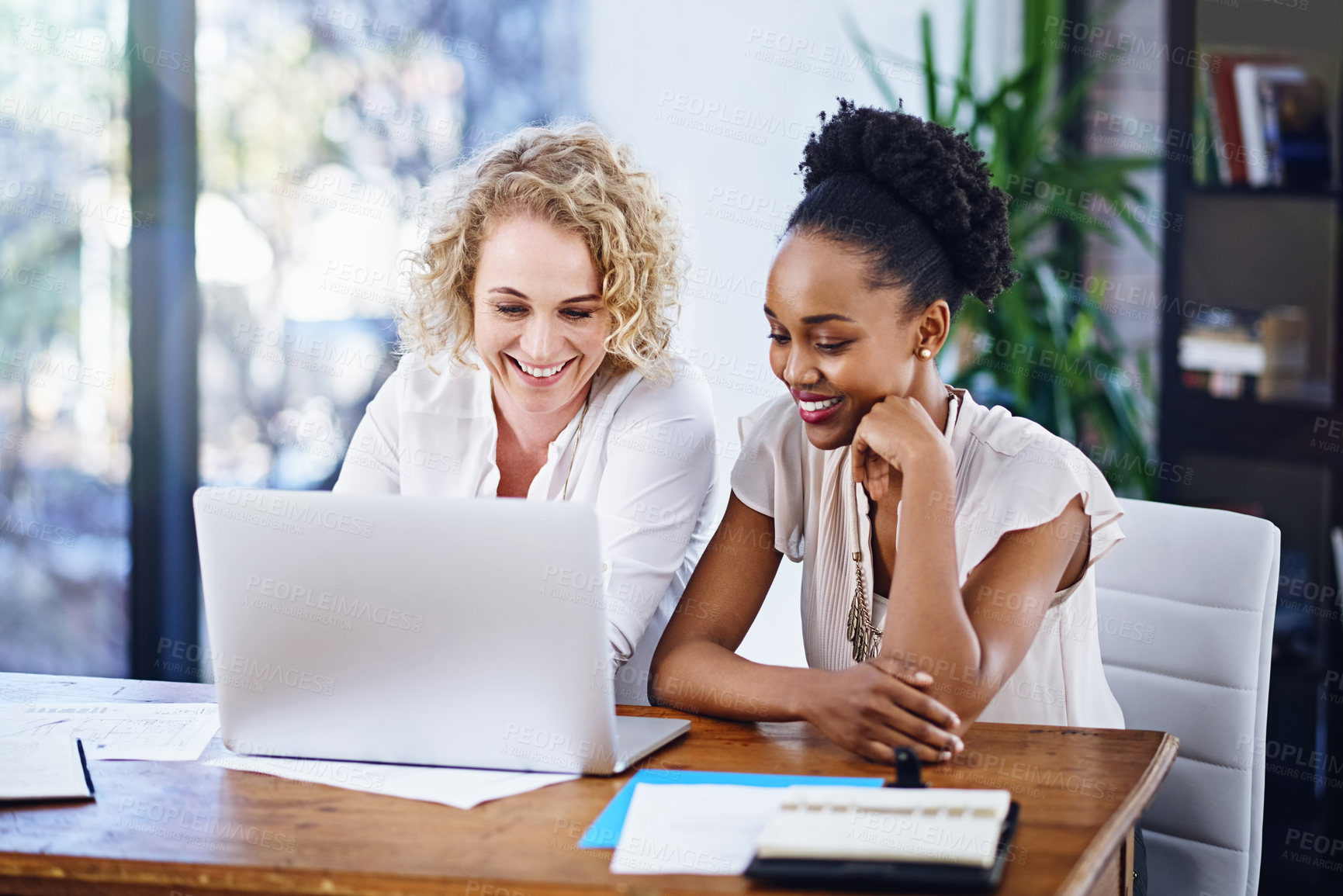 Buy stock photo Cropped shot of two designers working together in the office