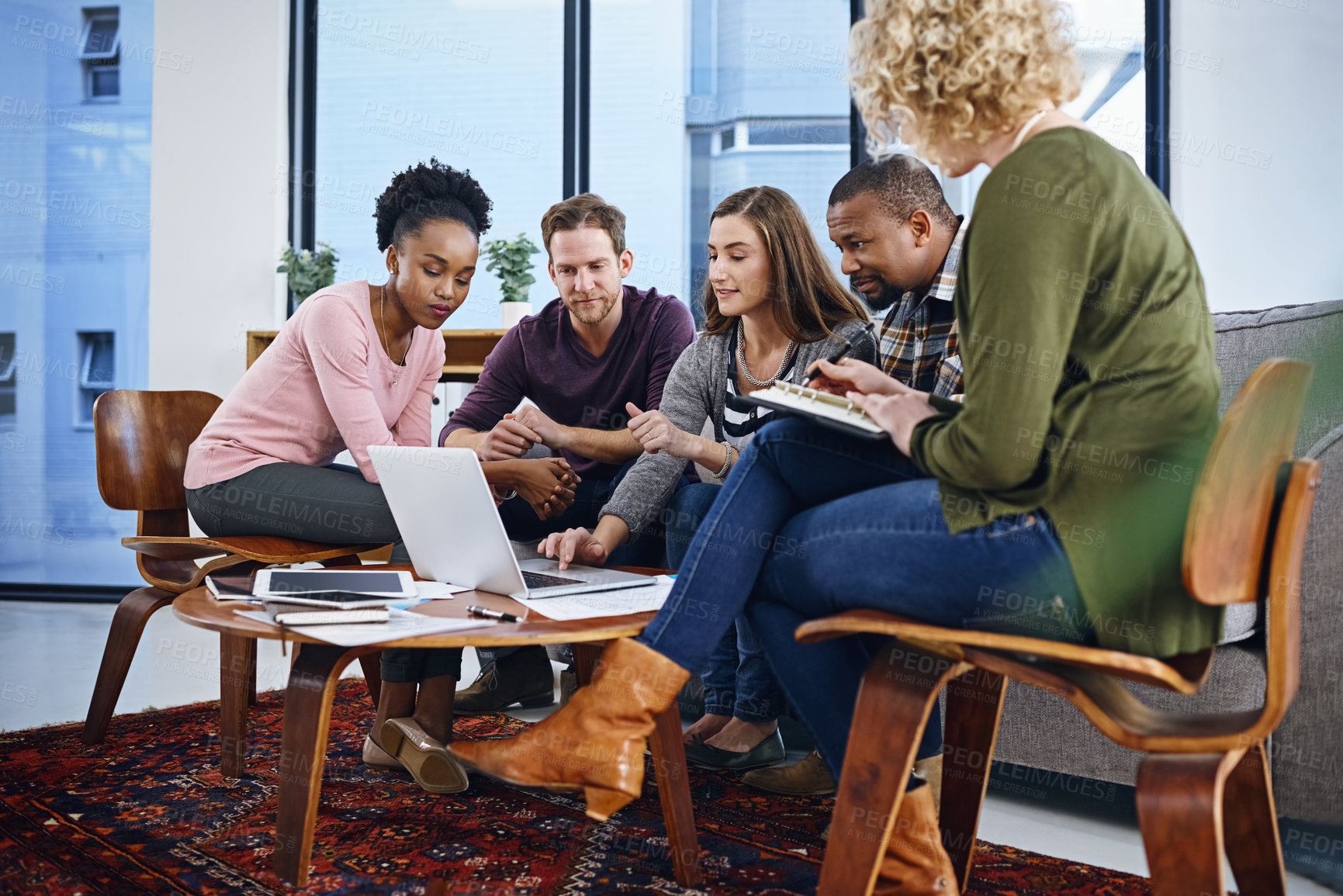 Buy stock photo Creative people, meeting and laptop with discussion for teamwork, planning or strategy at office. Group of employees on computer with paperwork or documents for collaboration or startup at workplace