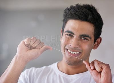 Buy stock photo Happy, portrait and man with floss in bathroom for dental hygiene, gum disease and oral care. Health, mouth and person with smile after brushing teeth for wellness, cleaning and fresh breath in home