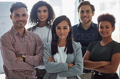Buy stock photo Portrait of a group of confident businesspeople standing together in the office