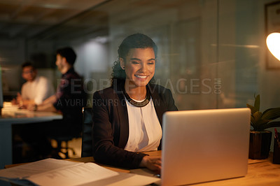Buy stock photo Laptop, night and business woman with smile at desk for project deadline, review or update records. Late, happiness and employee with paperwork for overtime, information or data entry clerk in office