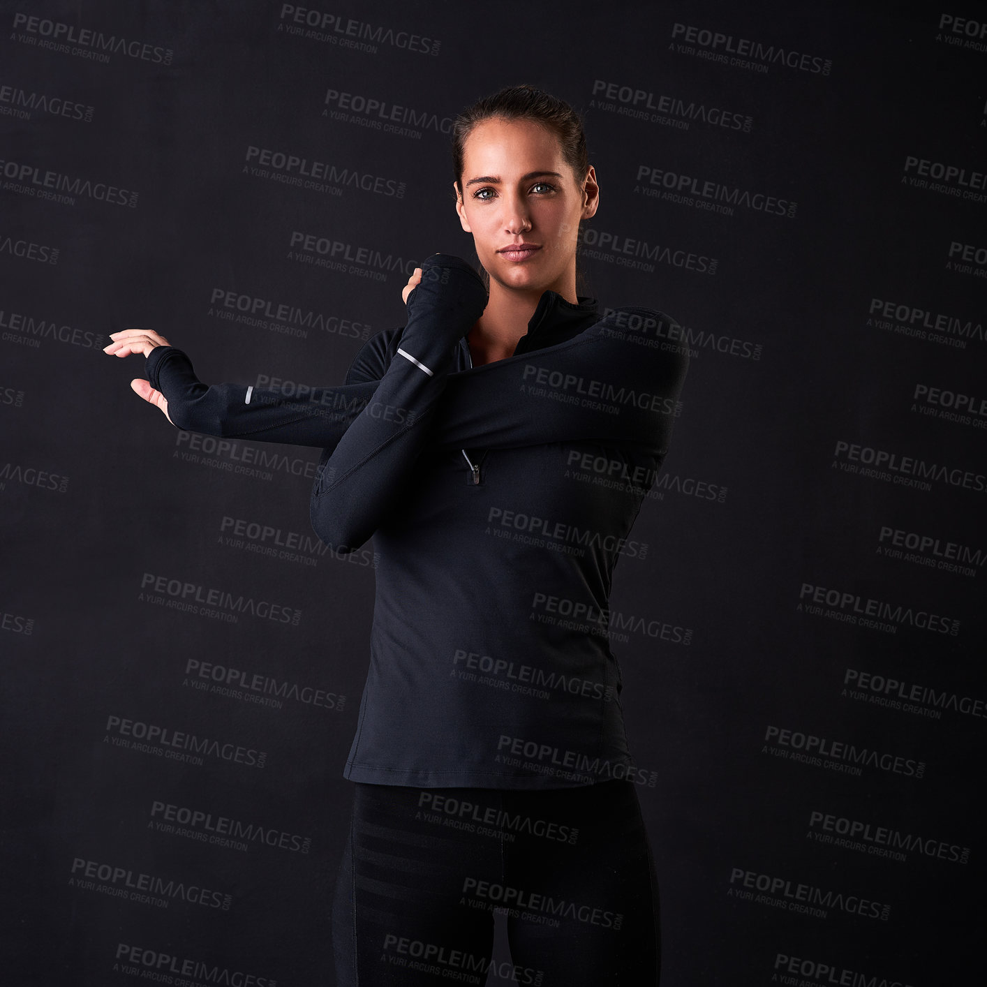 Buy stock photo Woman, portrait and stretching arms in studio for fitness, health or self care on black background. Female athlete, face and warm up for crossfit, wellness and performance goals at sports competition