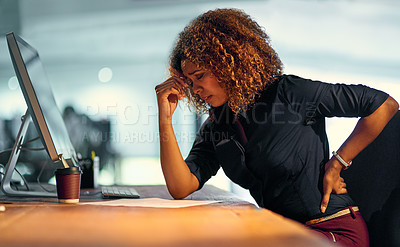 Buy stock photo Shot of a young businesswoman suffering from backache while working at night