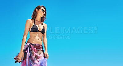 Buy stock photo Shot of a sexy young woman standing on the beach