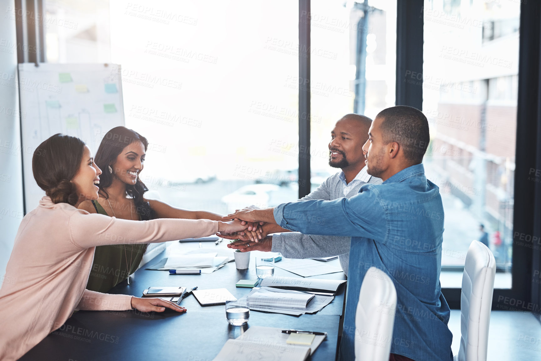 Buy stock photo Business, people and happy with huddle at office for teamwork, collaboration and ideas. Boardroom, employees and pile of hands with smile for brainstorming, strategy and planning with paperwork