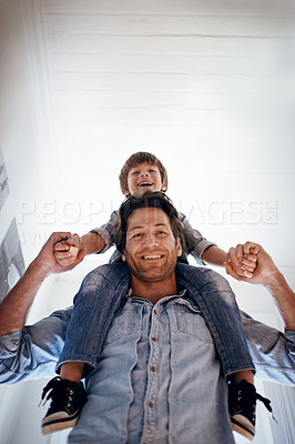 Buy stock photo Portrait, carry and son on shoulders of father in home from below for bonding, fun or relationship. Family, smile or happy with man parent and boy kid in apartment together for development or growth