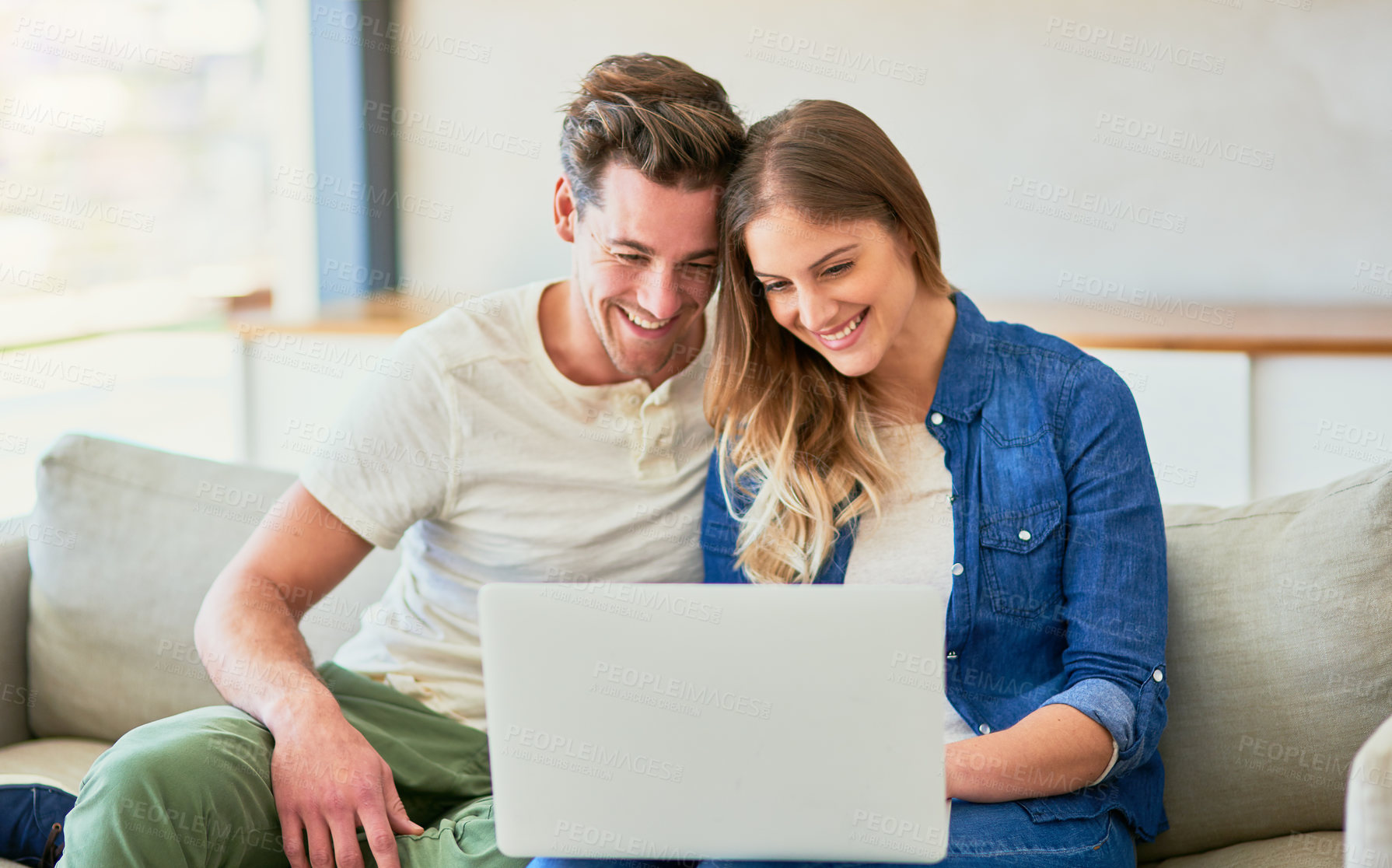 Buy stock photo Couple, sofa and online on laptop with happiness for approved application on rental confirmation for new apartment. Man, woman and together in home with internet for streaming comedy shows and movie.