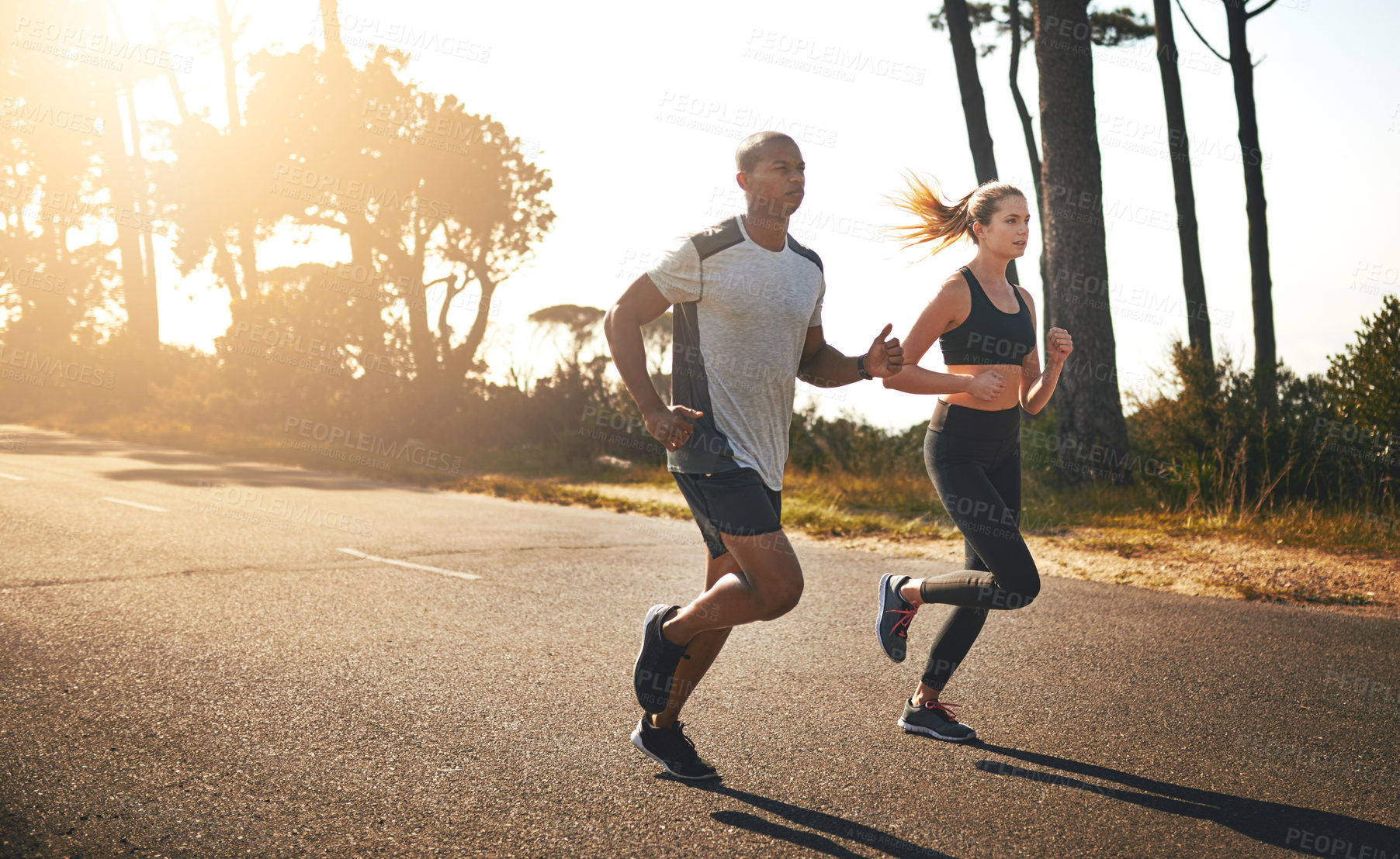 Buy stock photo Fitness, running and freedom with couple in road for workout, cardio performance and summer. Marathon, exercise and teamwork with black man and woman runner in nature for sports, training and race