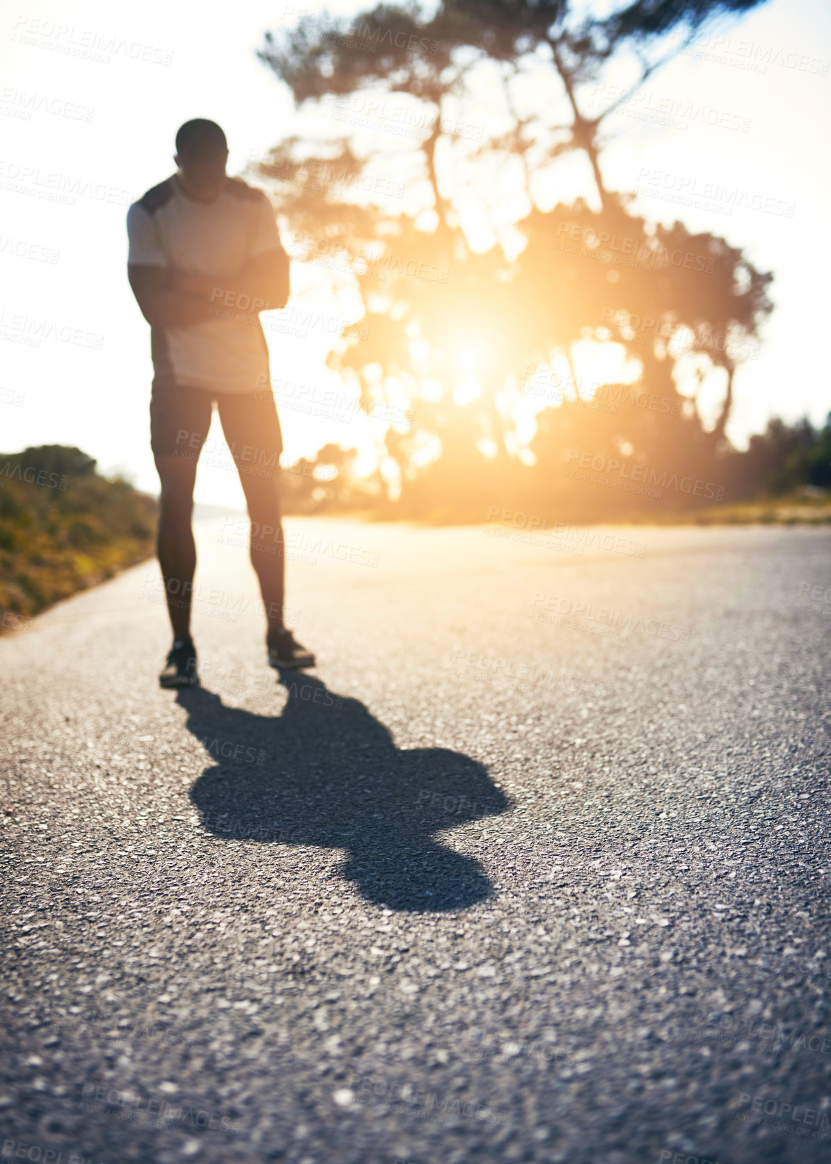 Buy stock photo Road, wellness and man with confidence for fitness, exercise or ready for marathon challenge. Arms crossed, male person and runner with goal for training, outdoor or healthy body with pride by sunset