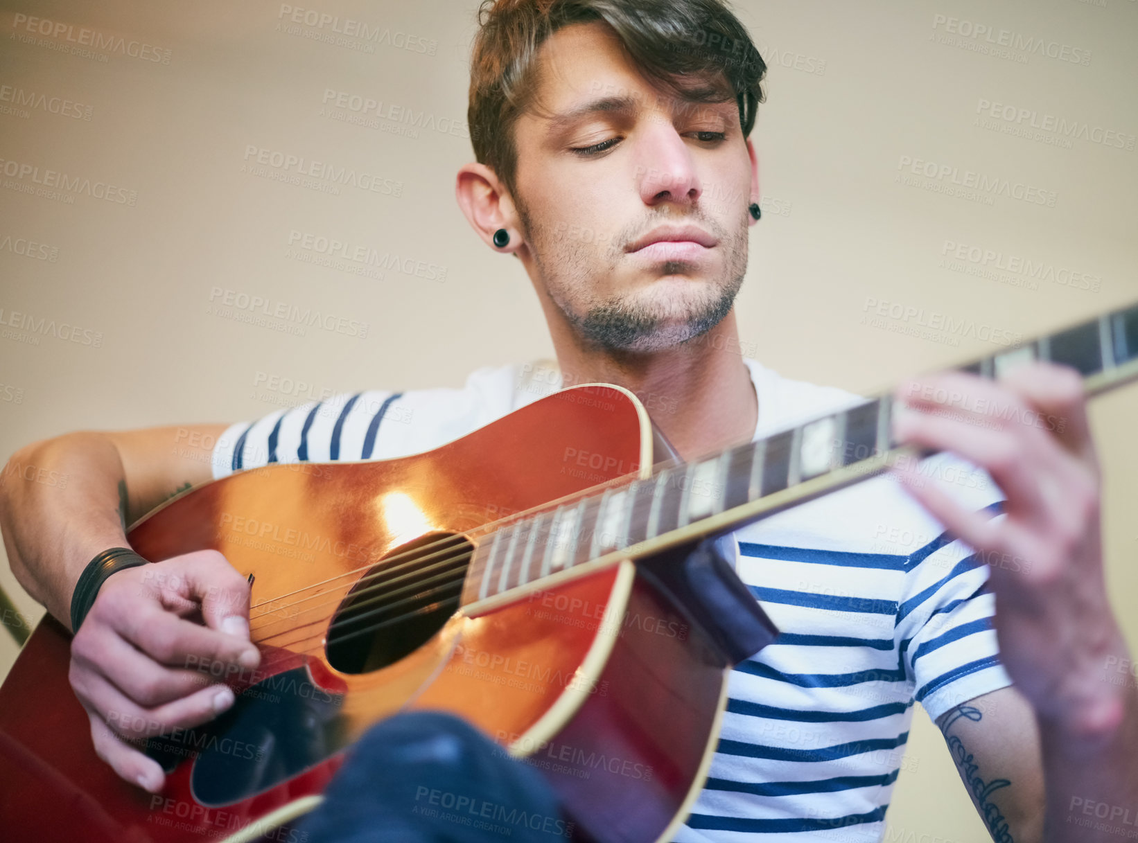 Buy stock photo Man, guitar and playing music instrument in home or skill learning as performance artist, production or jazz. Male person, hands and creative notes or acoustic rhythm as composer, track or equipment