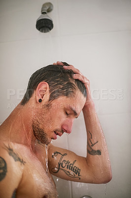 Buy stock photo Shot of a handsome young man having a shower