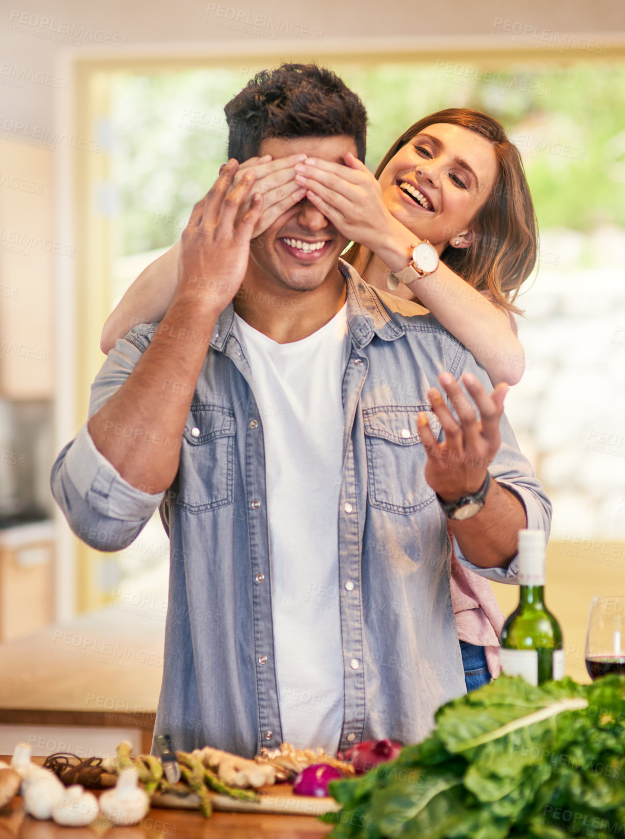 Buy stock photo Couple, people and happy with blinding in kitchen to cook for bonding, love and support on break together. Home, relationship and romance with smile or laugh for fun, play and care as soulmate