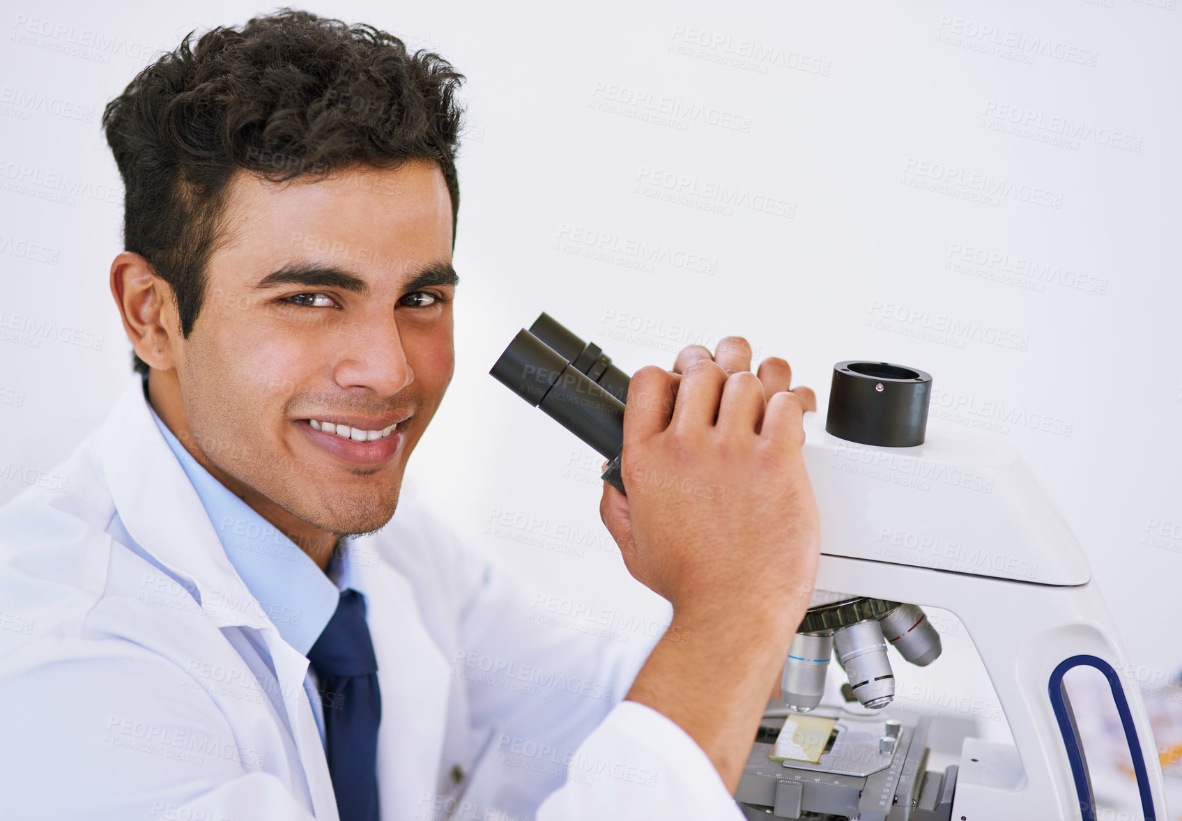 Buy stock photo Portrait, technician and microscope in laboratory for studying, research and innovation or chemistry. Happy, male person or medical scientist with tech for health breakthrough, analytics and biology