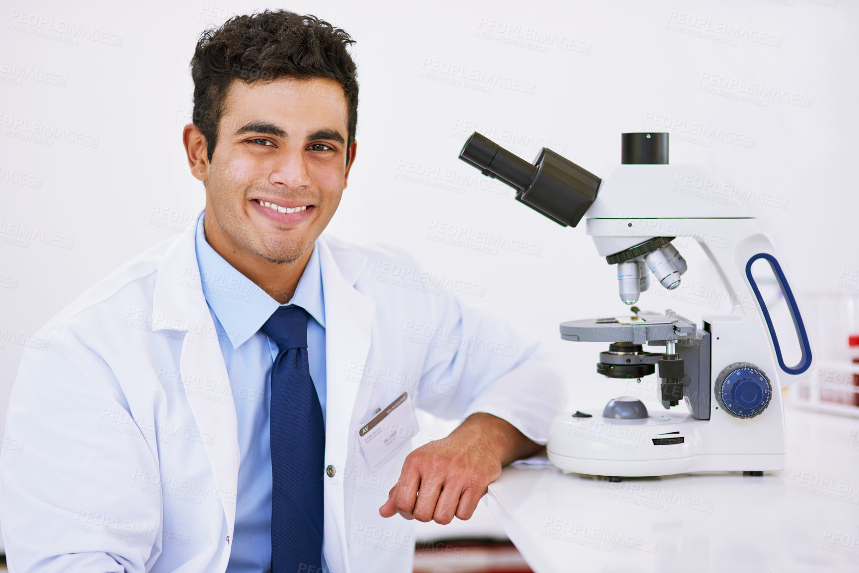 Buy stock photo Portrait, technician and microscope in laboratory for studying, research and innovation or chemistry. Happy, male person or medical scientist with tech for health breakthrough, analytics and biology