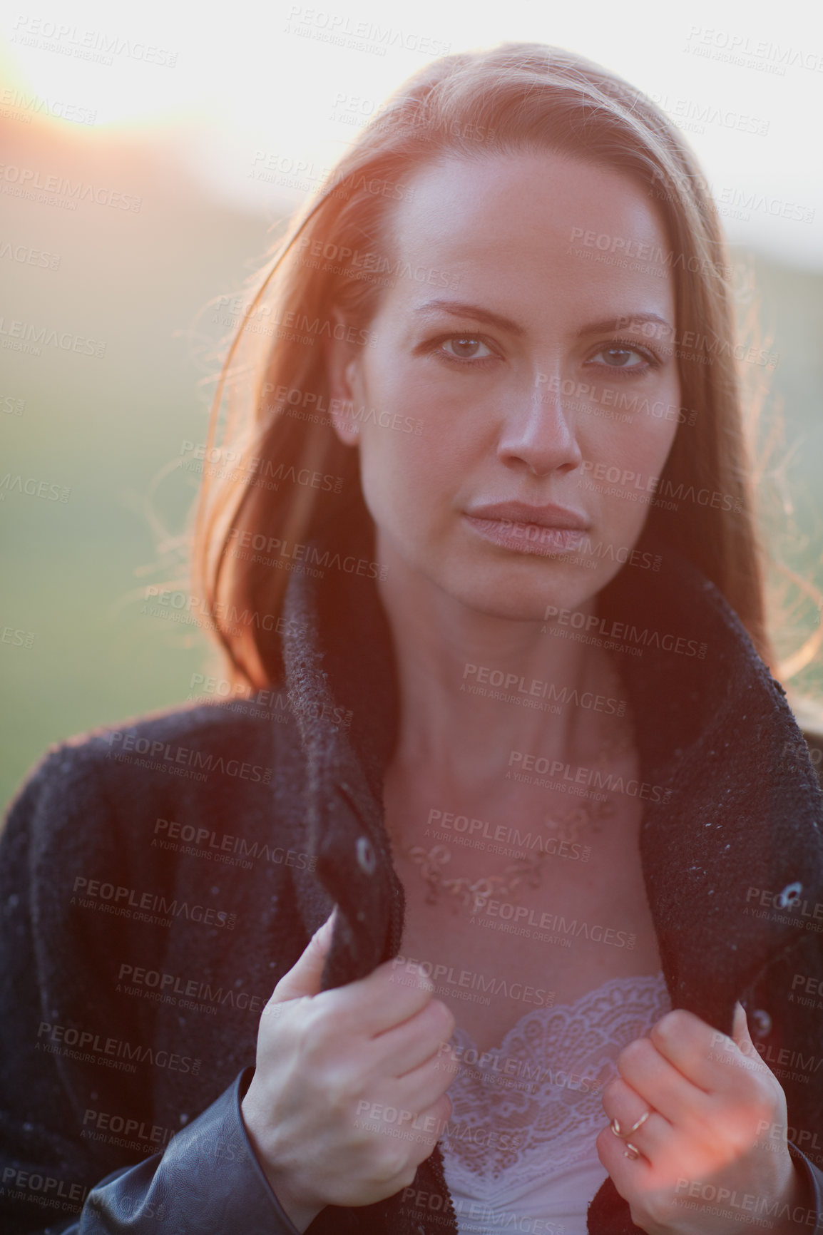 Buy stock photo Cropped portrait of an attractive woman posing outside