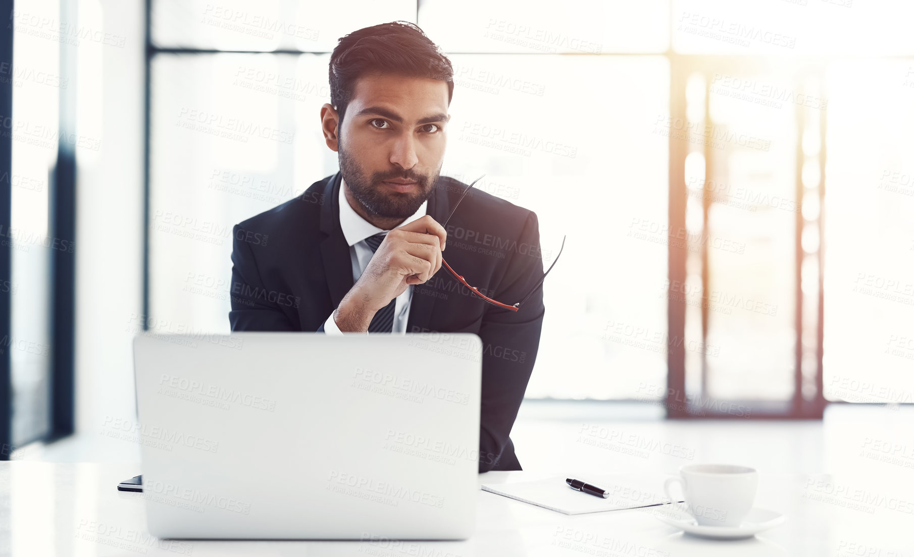 Buy stock photo Businessman, serious and portrait with laptop in office for case research, administration and contract review. Professional, lawyer and pride at firm for online consulting and planning legal proposal