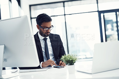 Buy stock photo Businessman, desk and typing with phone in office for investment, review or reading economy news. Financial advisor, computer and research on tech for stocks report, email and update on share price