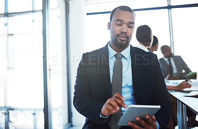 Buy stock photo Lawyer, tablet and black man in office for business, research or online browsing. Serious, digital technology and corporate African attorney, person or professional reading email, internet app or web
