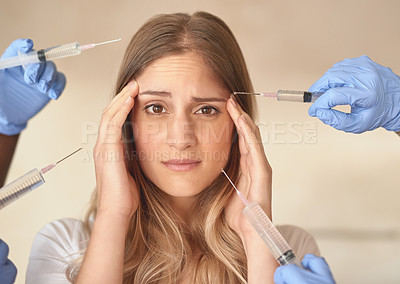 Buy stock photo Portrait of an anxious young woman with needles pointed around at her face