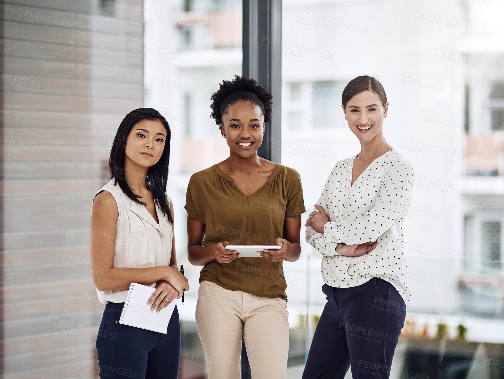 Buy stock photo Cropped portrait of a group of businesswomen standing together in a modern office