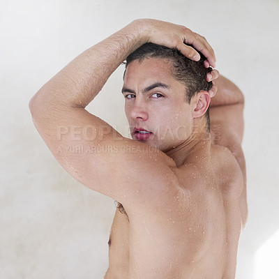 Buy stock photo Shot of a handsome young man having a refreshing shower at home