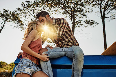 Buy stock photo Shot of an affectionate couple spending the day outdoors